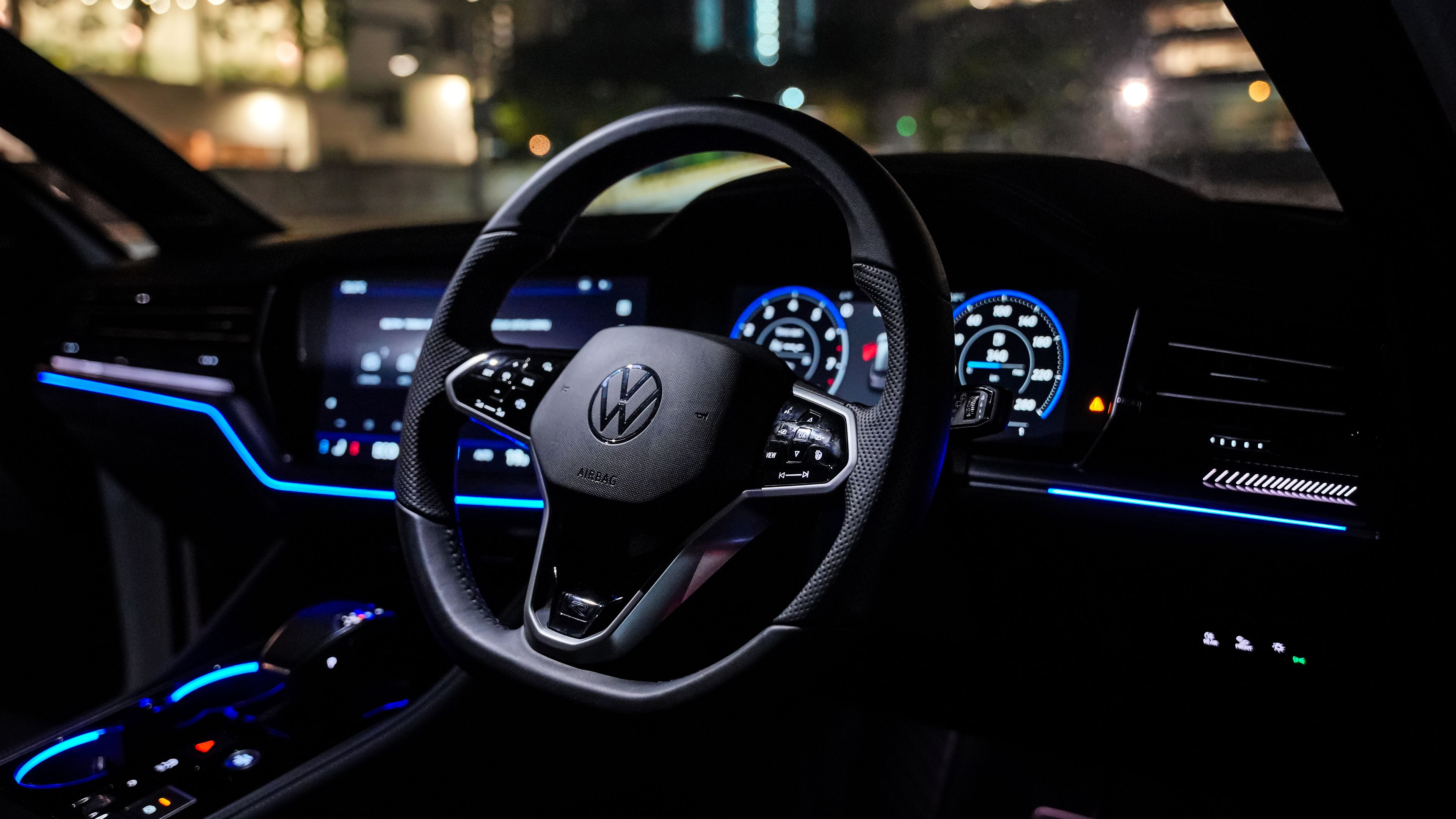 Volkswagen Touareg R-Line | Interior Interior view of the Volkswagen Touareg R-Line at night, highlighting the illuminated dashboard and steering wheel for a superior driving experience.