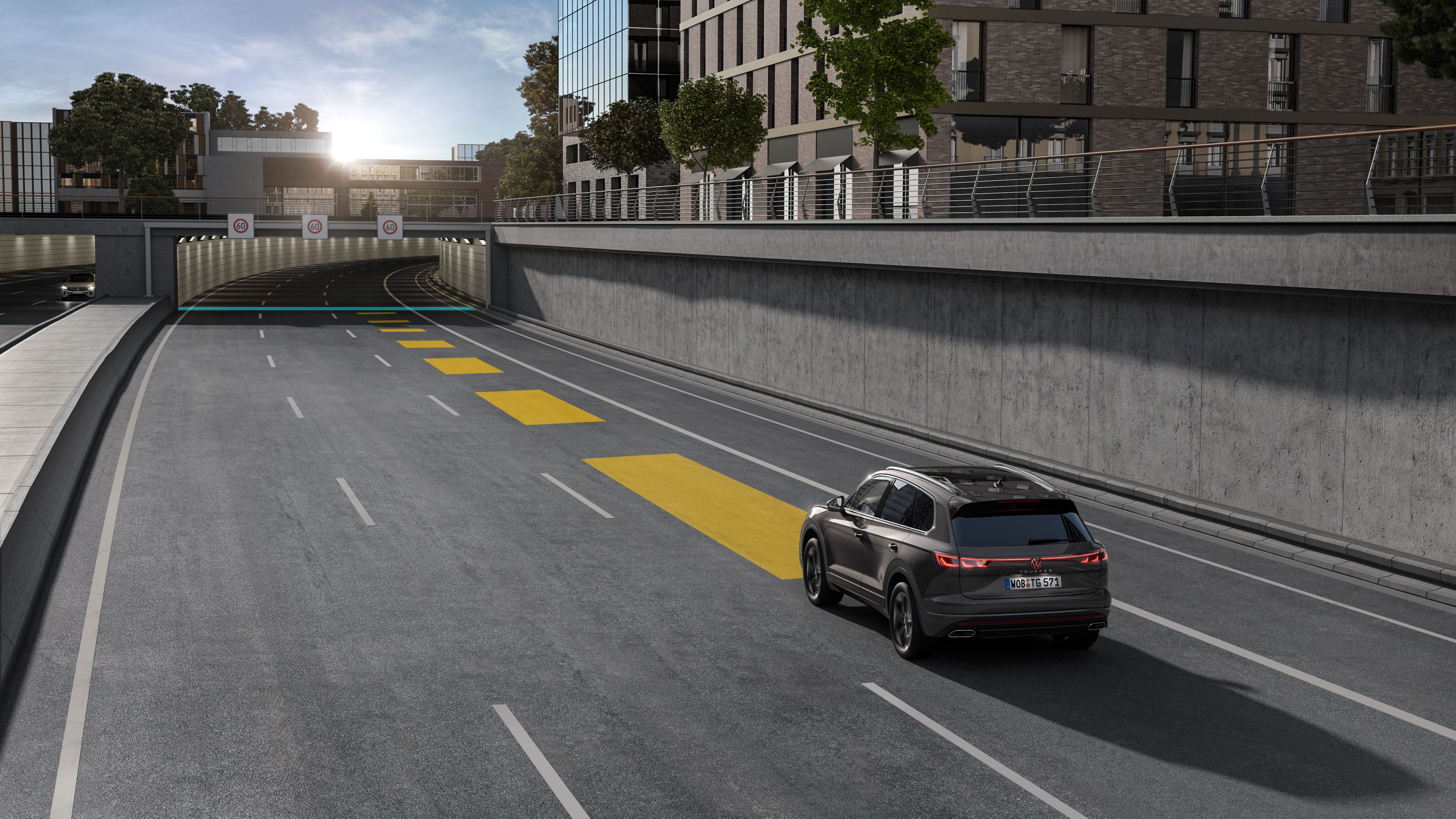 Volkswagen Touareg R-Line | Adaptive Cruise Control ACC A single Volkswagen Touareg R-Line driving into an underpass on a clear day.