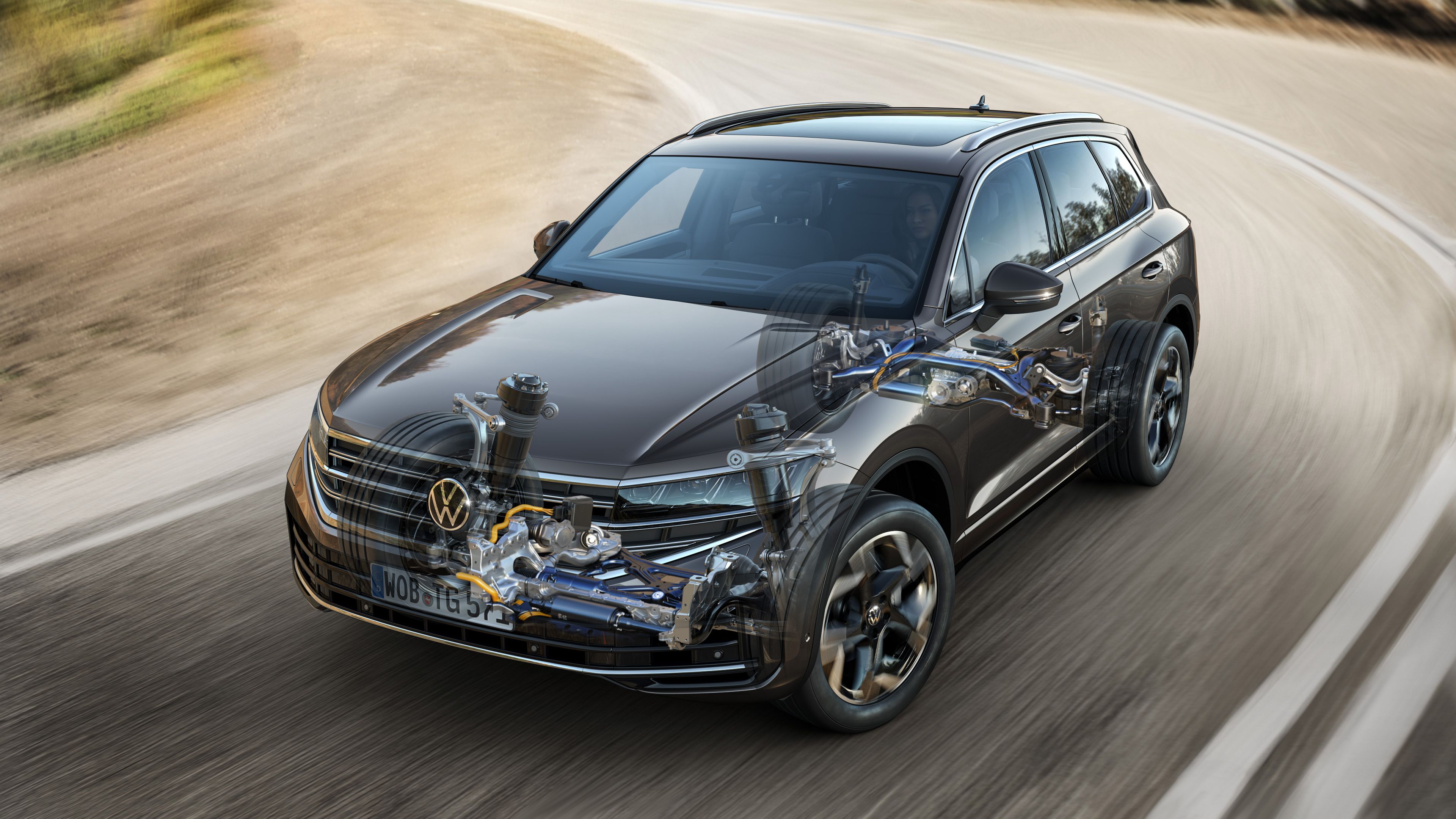 Volkswagen Touareg R-Line | 4MOTION all-wheel drive system A cutaway illustration showing the internal components of a Volkswagen Touareg R-Line, a premium SUV in motion on a road, providing a superior driving experience.