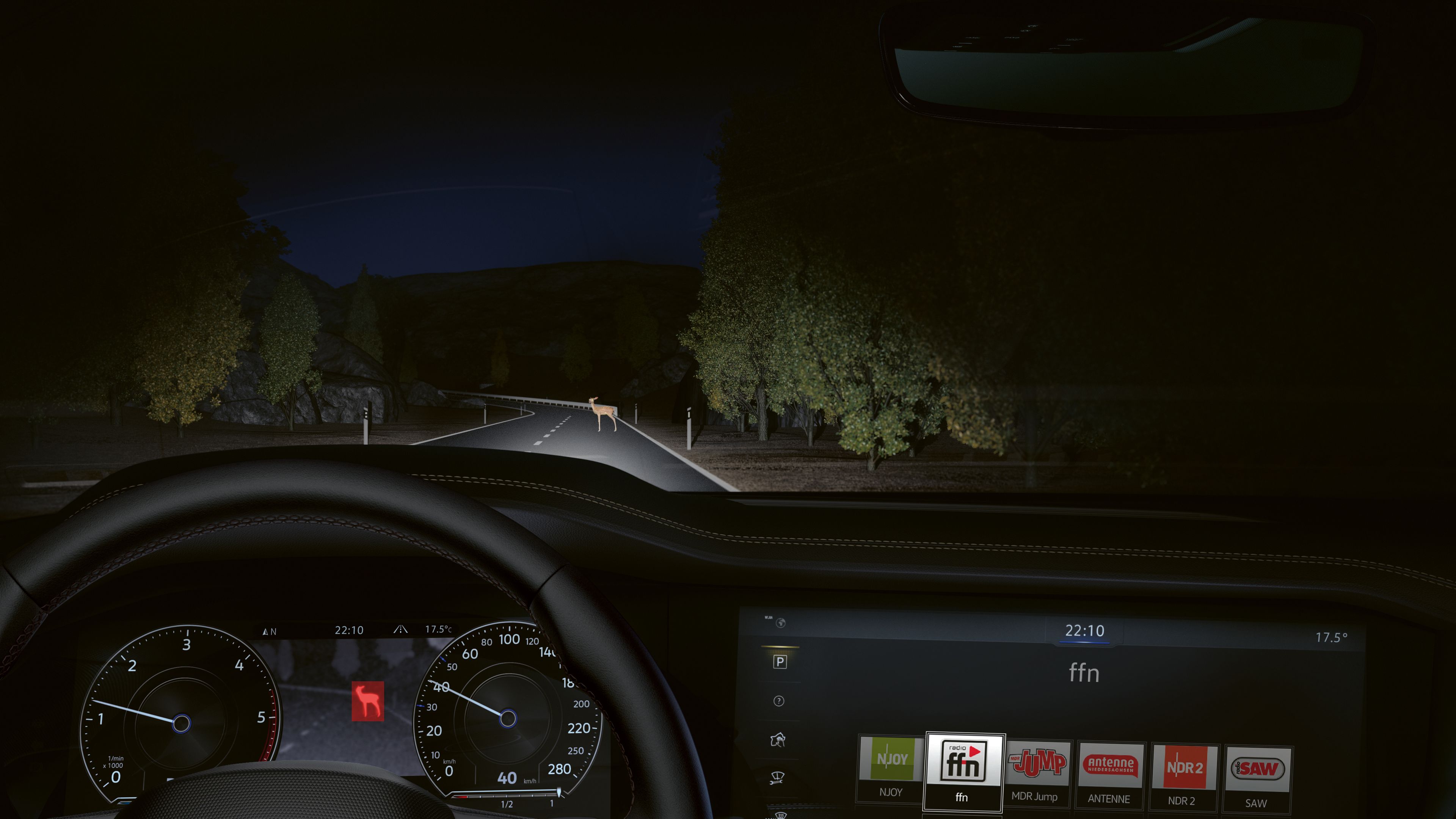 Volkswagen Touareg R-Line | Night Vision Driver's perspective of a nighttime drive showing a dark road illuminated by headlights, with a dashboard indicating speed and navigation in the Volkswagen Touareg R-Line, premium SUV.
